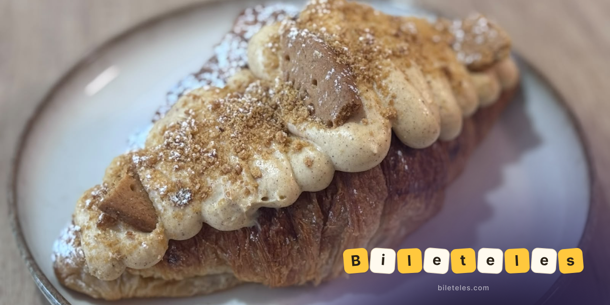 Croissant topped with Biscoff cream and biscuit pieces